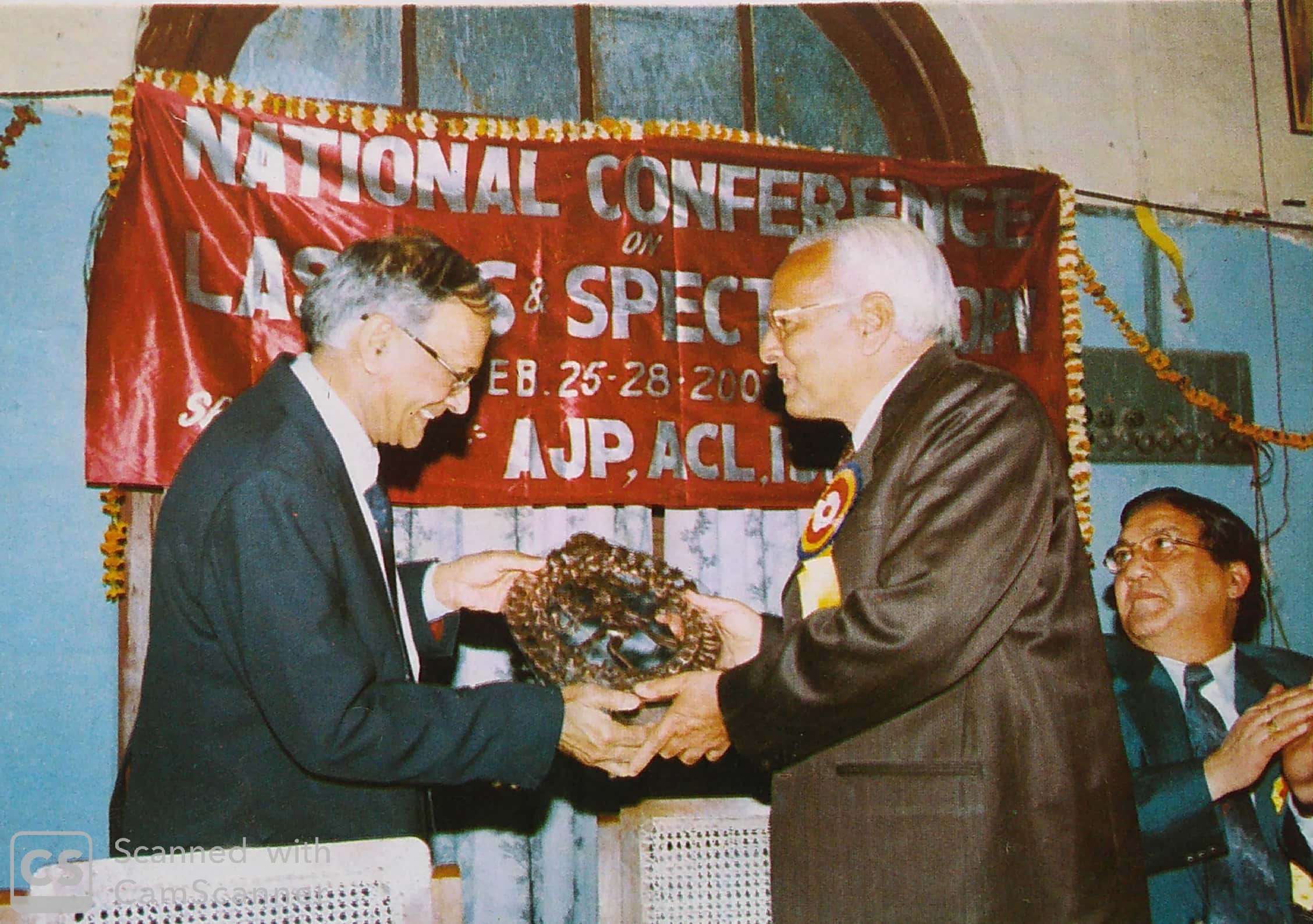 A K Ghatak (left) presenting momento to Prof Girish Saxena